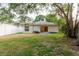 Backyard with a sliding glass door providing access to the house at 24839 Wild Frontier Dr, Land O Lakes, FL 34639