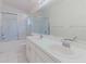 Bathroom featuring double sink vanity, shower over tub, and ample counter space at 24839 Wild Frontier Dr, Land O Lakes, FL 34639