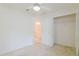 Bright bedroom featuring neutral walls, carpet flooring, and a ceiling fan for added comfort at 24839 Wild Frontier Dr, Land O Lakes, FL 34639