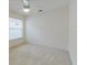 Bright bedroom featuring neutral walls, carpet flooring, a window providing ample natural light, and ceiling fan at 24839 Wild Frontier Dr, Land O Lakes, FL 34639