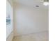 Neutral bedroom featuring carpet flooring, a window providing ample natural light, and ceiling fan at 24839 Wild Frontier Dr, Land O Lakes, FL 34639