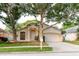 Charming single-Gathering home with a two-car garage and mature trees at 24839 Wild Frontier Dr, Land O Lakes, FL 34639