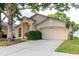 Beautiful one-story home featuring a two-car garage and well-maintained landscaping at 24839 Wild Frontier Dr, Land O Lakes, FL 34639