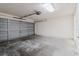 Spacious garage with concrete floor and a large door offering ample space for parking and storage at 24839 Wild Frontier Dr, Land O Lakes, FL 34639