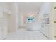 Bright, all-white kitchen features functional layout and great natural light at 24839 Wild Frontier Dr, Land O Lakes, FL 34639