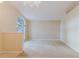Well-lit living room with arched window, and staircase, awaiting your personal touch at 24839 Wild Frontier Dr, Land O Lakes, FL 34639