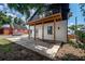 Back porch with wood support beams, providing covered outdoor space and entry to the home at 2718 N 21St St, Tampa, FL 33605