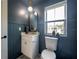 Stylish bathroom features custom vanity, gold fixtures, and beadboard accent wall at 2718 N 21St St, Tampa, FL 33605