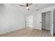 This well-lit bedroom features light hardwood flooring and is complemented by an attractive ceiling fan at 2718 N 21St St, Tampa, FL 33605