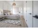 Inviting bedroom features neutral tones, cozy rug, side tables, and closet at 2718 N 21St St, Tampa, FL 33605