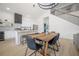 Dining room with a view of the stairs and kitchen, and featuring a vaulted ceiling at 2718 N 21St St, Tampa, FL 33605