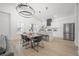 Open concept dining area with vaulted ceiling, statement chandelier, and connection to the kitchen at 2718 N 21St St, Tampa, FL 33605
