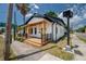 Exterior showcasing a craftsman home with a welcoming front porch, wood accents, and a well-manicured lawn at 2718 N 21St St, Tampa, FL 33605