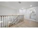 Hallway featuring hardwood flooring, a chandelier, and an adjoining bathroom at 2718 N 21St St, Tampa, FL 33605