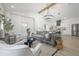 Open concept living room with a vaulted ceiling chandelier and seamless flow to the kitchen at 2718 N 21St St, Tampa, FL 33605