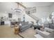Bright, modern living room with a large chandelier, open to the kitchen and stairs at 2718 N 21St St, Tampa, FL 33605