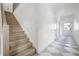 Bright foyer featuring an elegant staircase with wood treads and a striking black and white tiled floor at 2718 N 21St St, Tampa, FL 33605
