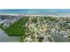 Aerial view of a coastal community with waterfront access, beautiful beaches and properties, and stunning ocean views at 300 10Th Ave, Indian Rocks Beach, FL 33785