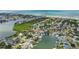 Picturesque waterfront community with lush greenery, private boat docks, and stunning views of the bay and beaches at 300 10Th Ave, Indian Rocks Beach, FL 33785