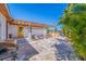 Covered backyard patio with outdoor seating and a barbecue grill, perfect for relaxing at 300 10Th Ave, Indian Rocks Beach, FL 33785