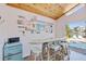 Charming bar area featuring wood ceiling, seating, and views of the pool and waterfront at 300 10Th Ave, Indian Rocks Beach, FL 33785