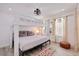 This bright bedroom is brightly lit and has a bunk bed and a low to the ground bed at 300 10Th Ave, Indian Rocks Beach, FL 33785