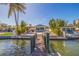 Waterfront home with lush tropical landscaping and spacious backyard with pool and patio at 300 10Th Ave, Indian Rocks Beach, FL 33785
