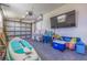 A well-organized garage featuring a paddleboard and ample storage solutions at 300 10Th Ave, Indian Rocks Beach, FL 33785