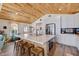 Open-concept kitchen with a large island, stainless steel appliances, and access to the living area and backyard at 300 10Th Ave, Indian Rocks Beach, FL 33785
