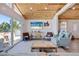 Inviting living room featuring wood ceiling, sliding glass doors, and beach-themed decor at 300 10Th Ave, Indian Rocks Beach, FL 33785