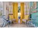 Inviting sitting area with natural light, colorful decor, and comfortable seating at 300 10Th Ave, Indian Rocks Beach, FL 33785
