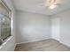 Comfortable bedroom featuring new flooring, a ceiling fan and a closet at 314 Barlow Ave # 73, Sarasota, FL 34232