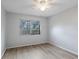 Bright bedroom with a ceiling fan, new flooring and a window overlooking outdoors at 314 Barlow Ave # 73, Sarasota, FL 34232