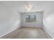 Bright bedroom with a ceiling fan, new flooring and a window overlooking the backyard at 314 Barlow Ave # 73, Sarasota, FL 34232
