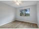 Bright bedroom featuring new flooring, a ceiling fan and a window overlooking the outdoors at 314 Barlow Ave # 73, Sarasota, FL 34232