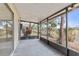 Screened-in patio with concrete flooring looks out onto the backyard at 314 Barlow Ave # 73, Sarasota, FL 34232