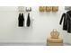 Organized closet with clothing rack, shelves, and woven storage baskets at 31670 Cannon Rush Dr, San Antonio, FL 33576