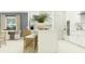 Bright, open kitchen with white cabinetry, a breakfast bar, and modern appliances at 31670 Cannon Rush Dr, San Antonio, FL 33576
