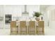 Bright kitchen features a center island with seating and modern appliances at 31670 Cannon Rush Dr, San Antonio, FL 33576
