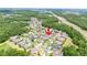 Wide aerial view of neighborhood showing the home's location near green spaces and a highway at 3227 Watermark Dr, Wesley Chapel, FL 33544