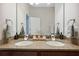 Close-up of a bathroom featuring double sinks and granite countertops in a modern design at 3227 Watermark Dr, Wesley Chapel, FL 33544