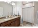Bathroom featuring double sinks, granite countertops, and a shower-tub combination at 3227 Watermark Dr, Wesley Chapel, FL 33544