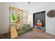 Bright bedroom featuring a custom climbing wall, slide, hammock, and flexible seating at 3227 Watermark Dr, Wesley Chapel, FL 33544