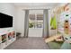 Bedroom featuring a custom climbing wall, slide, and hammock near a bright window at 3227 Watermark Dr, Wesley Chapel, FL 33544