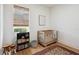 Bedroom with a crib, hardwood floors, rug, and window with blinds at 3227 Watermark Dr, Wesley Chapel, FL 33544
