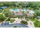 Aerial shot of the community center featuring pools, gathering areas, and beautifully maintained landscaping at 3227 Watermark Dr, Wesley Chapel, FL 33544