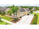 View of the home showcasing a manicured lawn and ample driveway space at 3227 Watermark Dr, Wesley Chapel, FL 33544