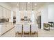 Modern kitchen features a large island, stainless steel appliances, stylish backsplash, and plenty of cabinet space at 3227 Watermark Dr, Wesley Chapel, FL 33544