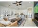 Spacious open-concept living area connects seamlessly to kitchen and dining, perfect for modern living and entertaining at 3227 Watermark Dr, Wesley Chapel, FL 33544