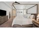 Bright main bedroom featuring a beautiful canopy bed and neutral decor with lots of natural light at 3227 Watermark Dr, Wesley Chapel, FL 33544